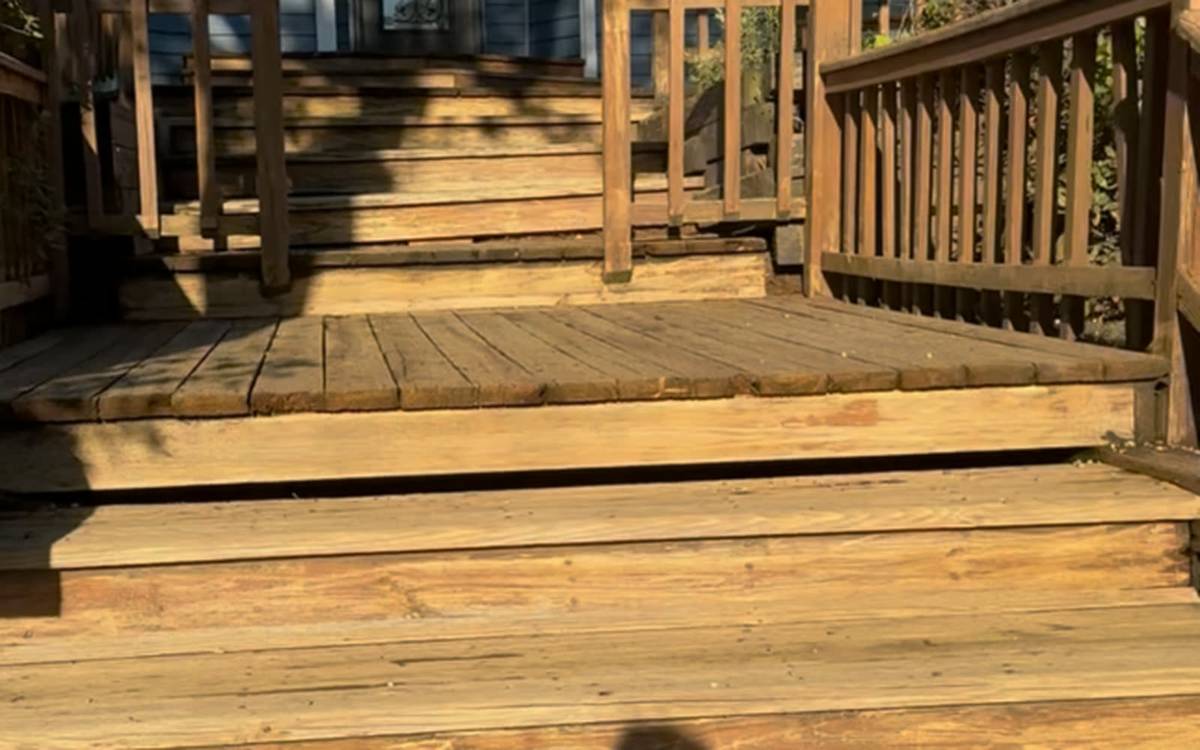 A freshly cleaned and stained backyard deck after a professional wash and seal by Hydro Bros Pro Wash